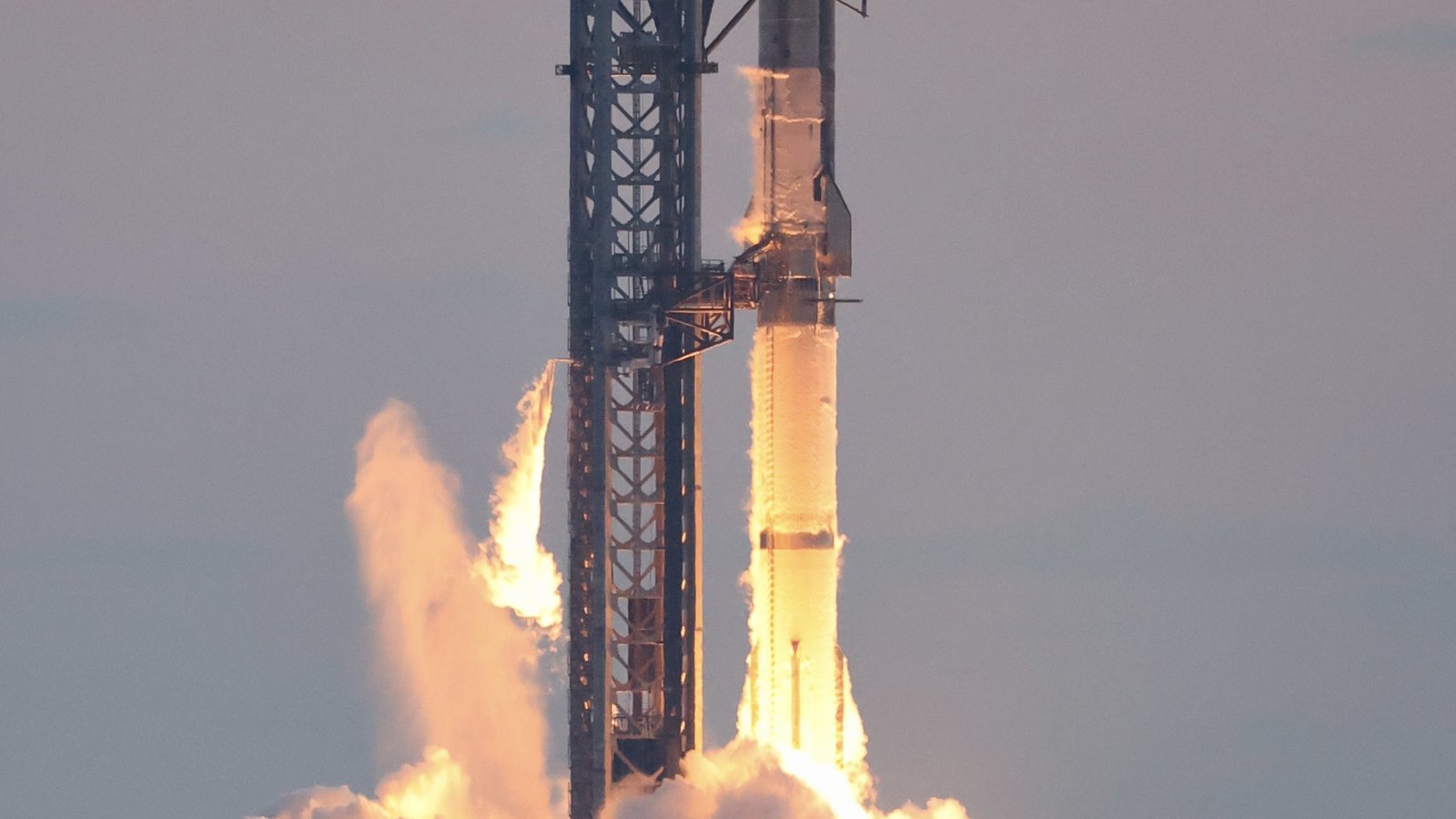A SpaceX Starship vehicle igniting its engines at launch