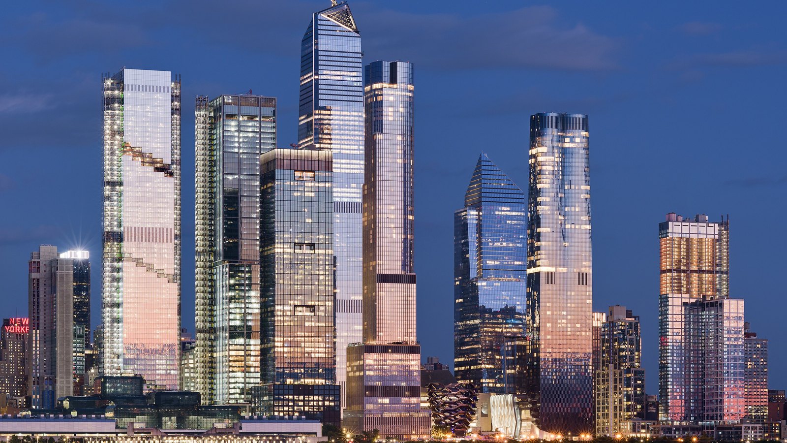 Manhattan high-rise towers along the Hudson River at dusk